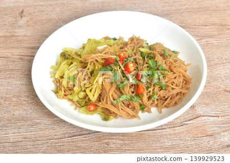 stir-fried Thai fermented rice noodles with chili topping pickled cabbage on plate stir-fried Thai fermented rice noodles with chili topping pickled cabbage on plate 139929523