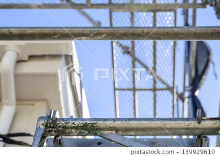 A photo of the roof renovation site with the scaffolding in focus. 139929610