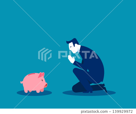 FInancial. A businessman is kneeling and praying to a piggy bank FInancial. A businessman is kneeling and praying to a piggy bank 139929972