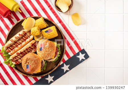 American barbecue food with burgers hot dogs and copy space on white background American barbecue food with burgers hot dogs and copy space on white background 139930247