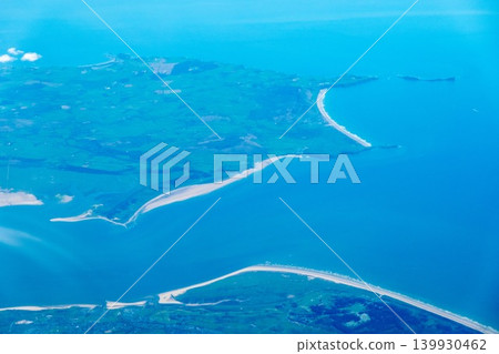 Aerial View of Coastal Barrier Islands and Curving Blue Ocean Shoreline Aerial View of Coastal Barrier Islands and Curving Blue Ocean Shoreline 139930462