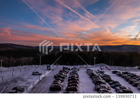 Snowshoe West Virginia Sunset Over Snow Covered Parking Lot with Mountain Landscape  139930711