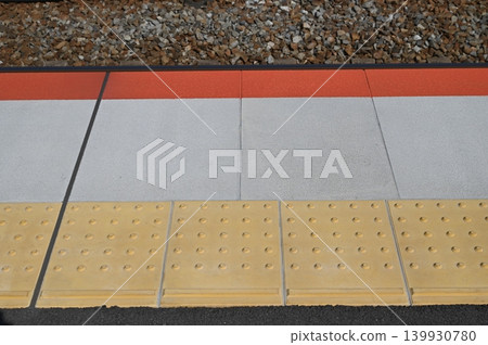Tactile paving for the visually impaired on the platform 139930780