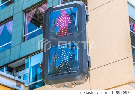 A view of the cityscape of Yokohama, Japan, including the traffic lights in front of Sakuragicho Station. Yokohama Landmark Tower is visible. 139930975