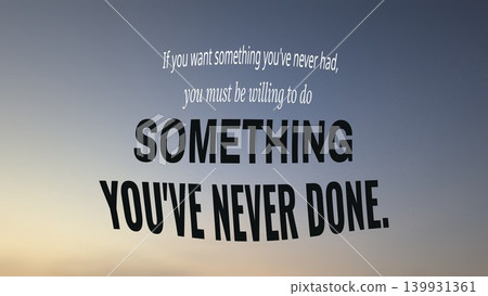 An inspirational quote, If you want something you've never had, you must be willing to do SOMETHING YOU'VE NEVER DONE. is overlaid on a soft sunset sky. An inspirational quote, If you want something you've never had, you must be willing to do SOMETHING YOU'VE NEVER DONE. is overlaid on a soft sunset sky. 139931361