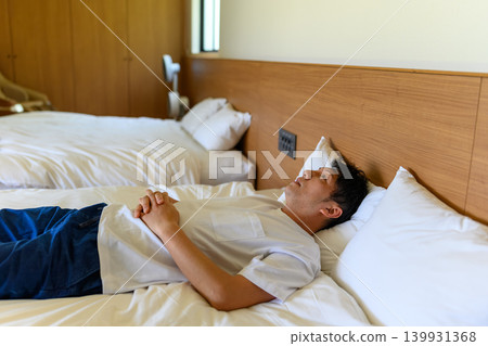 A man lying in bed 139931368