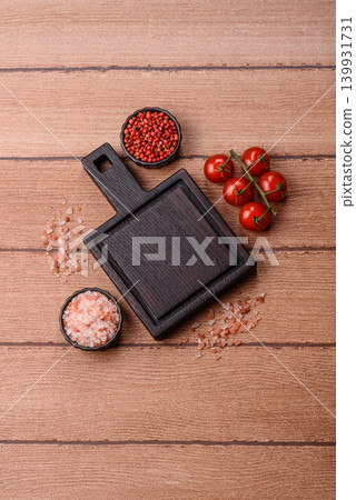 Empty wooden cutting board for preparing ingredients for home cooking. An empty cutting board Empty wooden cutting board for preparing ingredients for home cooking. An empty cutting board 139931731