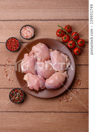 Raw chicken thigh fillet, boneless and skinless, for roasting. Raw thigh fillet Raw chicken thigh fillet, boneless and skinless, for roasting. Raw thigh fillet 139931749