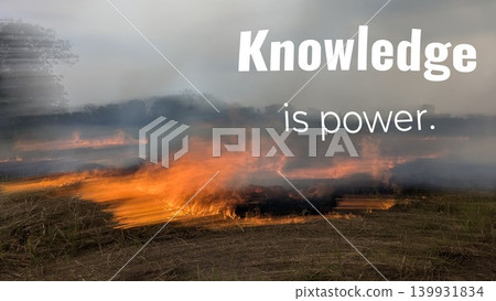 A motivational quote over a field of fire and smoke. The text reads, "KNOWLEDGE is power." The word "Knowledge" is large, with "is" and "power" in smaller fonts. A motivational quote over a field of fire and smoke. The text reads, "KNOWLEDGE is power." The word "Knowledge" is large, with "is" and "power" in smaller fonts. 139931834