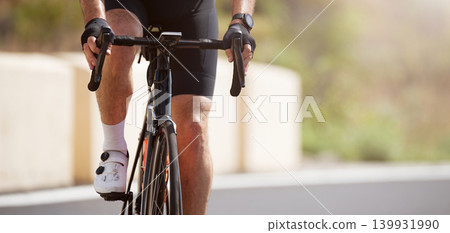 Road bike cyclist man cycling, athlete on a race cycle handlebar detail 139931990