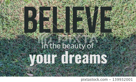 A motivational quote against a backdrop of a neatly cut lawn with an exposed patch of dirt in the foreground. The text states "BELIEVE in the beauty of your DREAMS." A motivational quote against a backdrop of a neatly cut lawn with an exposed patch of dirt in the foreground. The text states "BELIEVE in the beauty of your DREAMS." 139932001