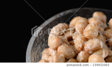 A close-up of natto served in a small glass bowl. A close-up of natto served in a small glass bowl. 139932003