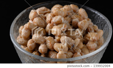 A close-up of natto served in a small glass bowl. A close-up of natto served in a small glass bowl. 139932004