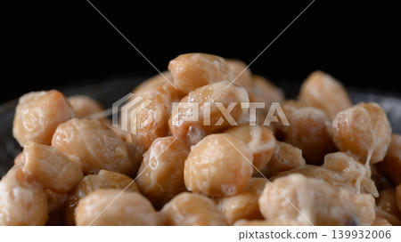 A close-up of natto served in a small glass bowl. A close-up of natto served in a small glass bowl. 139932006