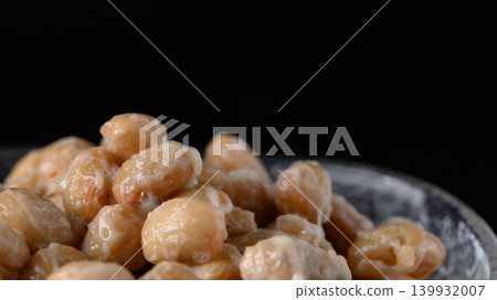 A close-up of natto served in a small glass bowl. A close-up of natto served in a small glass bowl. 139932007