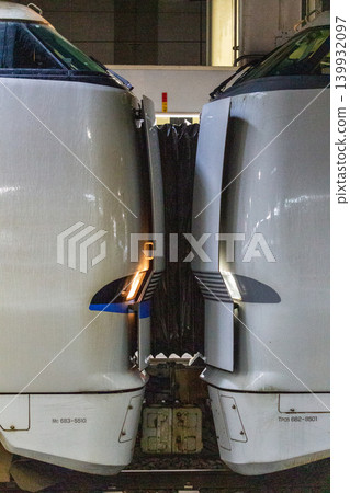 The coupling section of an express train; an image of two train sets being joined together. 139932097