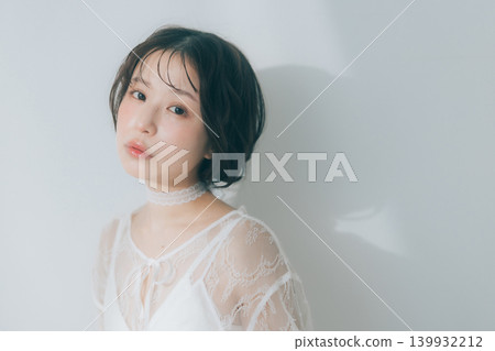A young woman with her hair tied up A young woman with her hair tied up 139932212