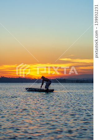 Traditional Fisherman Working on Wooden Boat at Sunset Traditional Fisherman Working on Wooden Boat at Sunset 139932231