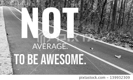 A striking black and white image displays the words "NOT AVERAGE. TO BE AWESOME." on a winding road through a forest. A few leaves dot the pavement. A striking black and white image displays the words "NOT AVERAGE. TO BE AWESOME." on a winding road through a forest. A few leaves dot the pavement. 139932309