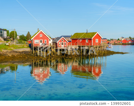 View of a traditional moss-roof house on the Lofoten Islands, Norway. Scenic summer landscape. View of a traditional moss-roof house on the Lofoten Islands, Norway. Scenic summer landscape. 139932601