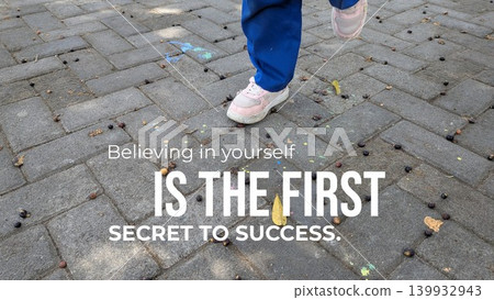A graphic featuring an inspirational quote on a paved outdoor surface with an image of someone's legs and feet. The text says "Believing in yourself IS THE FIRST SECRET TO SUCCESS." A graphic featuring an inspirational quote on a paved outdoor surface with an image of someone's legs and feet. The text says "Believing in yourself IS THE FIRST SECRET TO SUCCESS." 139932943