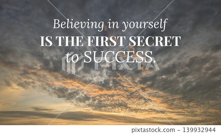 An uplifting image with the quote "Believing in yourself IS THE FIRST SECRET to SUCCESS" superimposed over a sky filled with dramatic clouds at sunrise. The clouds are dark gray and golden. 139932944