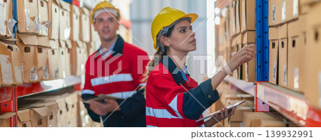 Warehouse worker working in warehouse storage.  139932991