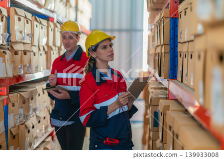 Warehouse worker working in warehouse storage. Warehouse worker working in warehouse storage. 139933008