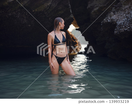 Young woman enjoying serene evening at sea in Krabi, Thailand Young woman enjoying serene evening at sea in Krabi, Thailand 139933219