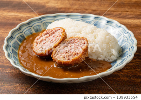 Menchi Katsu Curry: Curry rice topped with a juicy minced meat cutlet. Menchi Katsu Curry: Curry rice topped with a juicy minced meat cutlet. 139933554