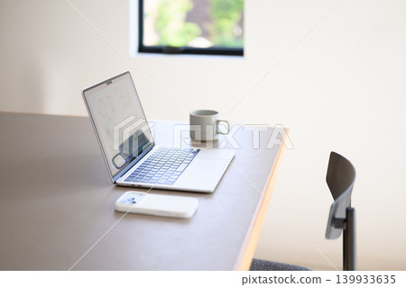 Laptop and mug 139933635