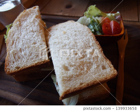 A plate of bread like the kind you'd find at a cafe for breakfast. A plate of bread like the kind you'd find at a cafe for breakfast. 139933658
