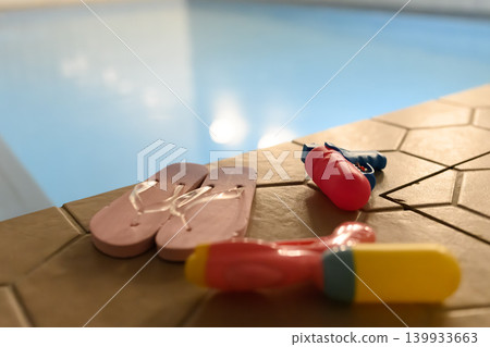 Summer toys by the poolside 139933663