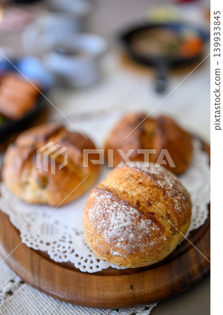 Freshly baked bread on a wooden tray Freshly baked bread on a wooden tray 139933845