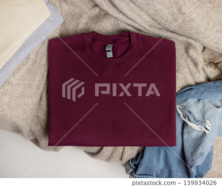 Blank dark red unisex sweatshirt mockup, folded crewneck casual flat lay with copy space on front Blank dark red unisex sweatshirt mockup, folded crewneck casual flat lay with copy space on front 139934026