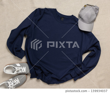 Blank dark blue unisex sweatshirt mockup, crewneck template flat lay with sneakers and baseball cap Blank dark blue unisex sweatshirt mockup, crewneck template flat lay with sneakers and baseball cap 139934037
