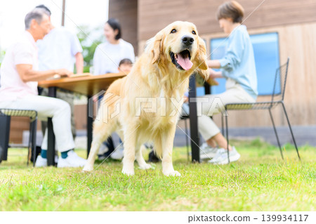 Family and dog spending time together outdoors Family and dog spending time together outdoors 139934117