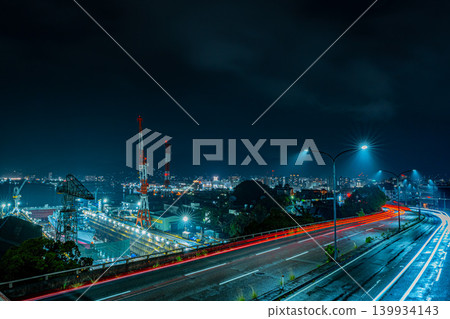 Night view of the Kure shipyard in Hiroshima, Japan, and laser beams on the road. 139934143