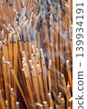 Close-Up Of Burned Incense Sticks With Smoke Rising In A Temple Ritual Offering 139934191