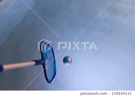 Scoop up the sphere with a net. Scoop up the sphere with a net. 139934231