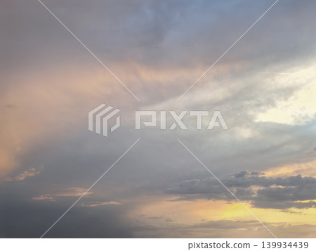 Pastel Storm Clouds During Colorful Sunset Pastel Storm Clouds During Colorful Sunset 139934439