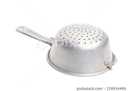 Aluminum colander isolated on white. Cooking utensil. Aluminum colander isolated on white. Cooking utensil. 139934469