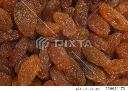 Dried fruits raisins background. Dried grapes 139934473