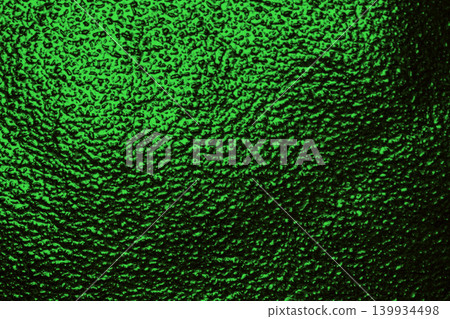 Green textured glass background macro dark emerald surface close up Green textured glass background macro dark emerald surface close up 139934498