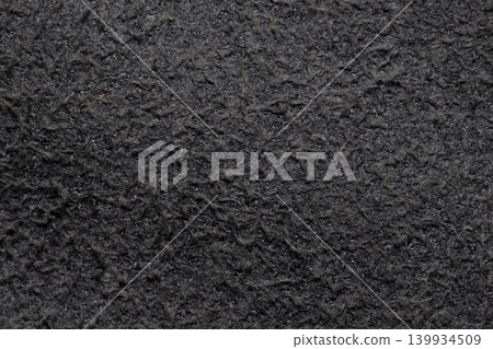 Black fleece fabric texture macro winter clothing background close up Black fleece fabric texture macro winter clothing background close up 139934509