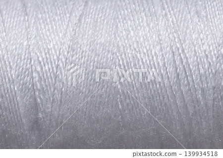 White sewing thread texture background macro close up White sewing thread texture background macro close up 139934518