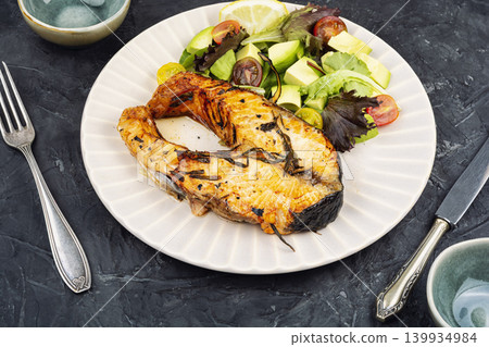 Roasted Trout Steak Served with Fresh Salad and Lemon Roasted Trout Steak Served with Fresh Salad and Lemon 139934984