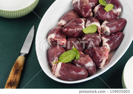 Uncooked turkey hearts with herbs Uncooked turkey hearts with herbs 139935003