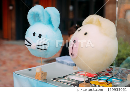 Animal shaped cotton candy for sale at park Animal shaped cotton candy for sale at park 139935061