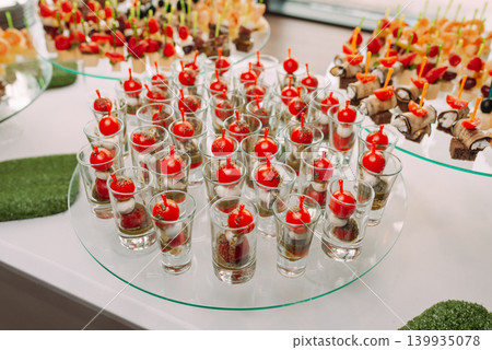 Assorted canapes and finger foods on trays for a holiday buffet Assorted canapes and finger foods on trays for a holiday buffet 139935078